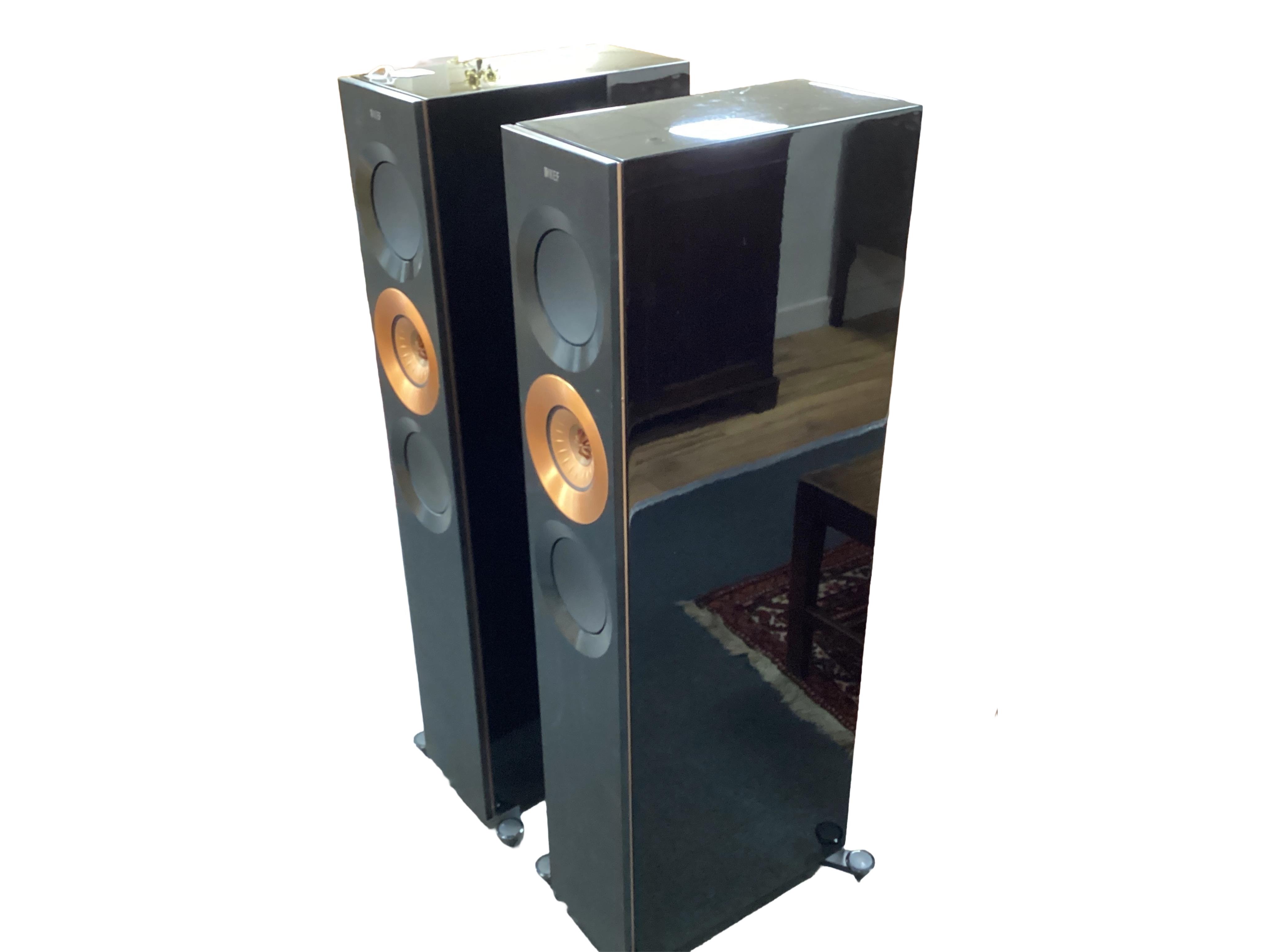 A pair of flooring standing limited edition KEF Reference 3 stereo speakers, the ‘Foundry Edition’, finished in gloss black with copper speaker surrounds on the centre speakers and copper finished plaque to the reverse c